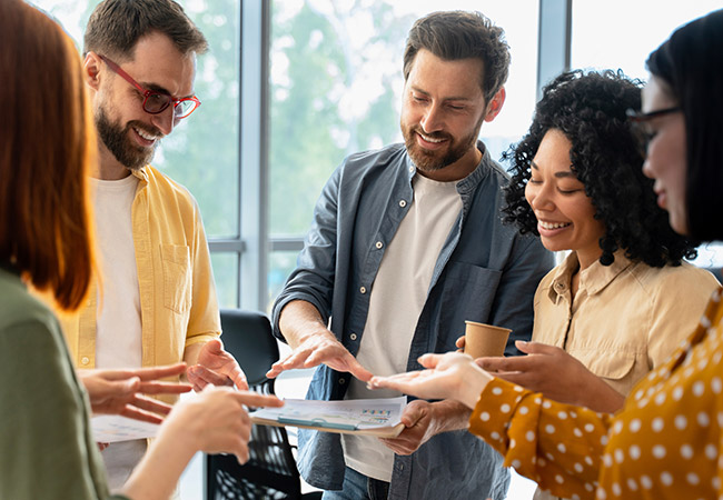 Group of diverse business people having a discussion in office interior