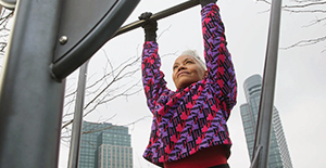 older woman exercising outdoors